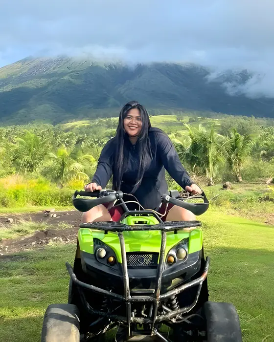 A Unicorn on an ATV in front of a green volcano